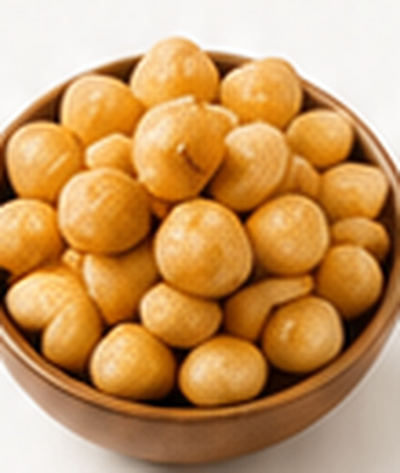 Roasted macadamia kernels in a bowl